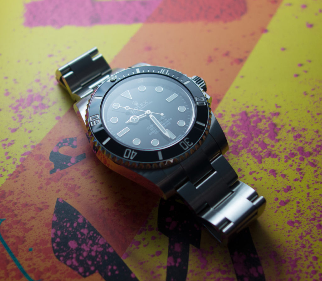 Stimmiges Gesamtbild: Die glänzende Keramiklünette und das Saphirglas der Rolex Submariner